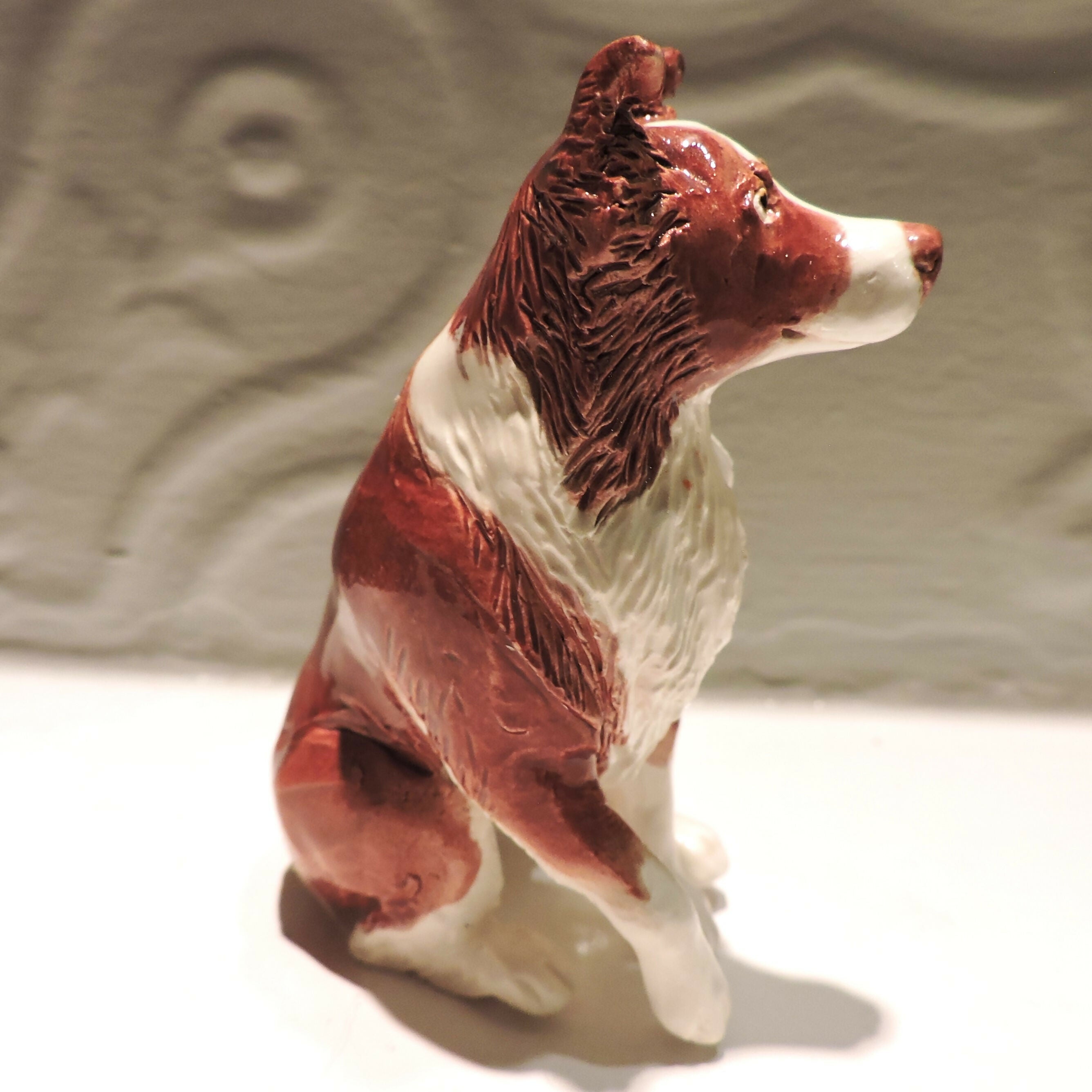 Ceramic border collie dog sculpture, red