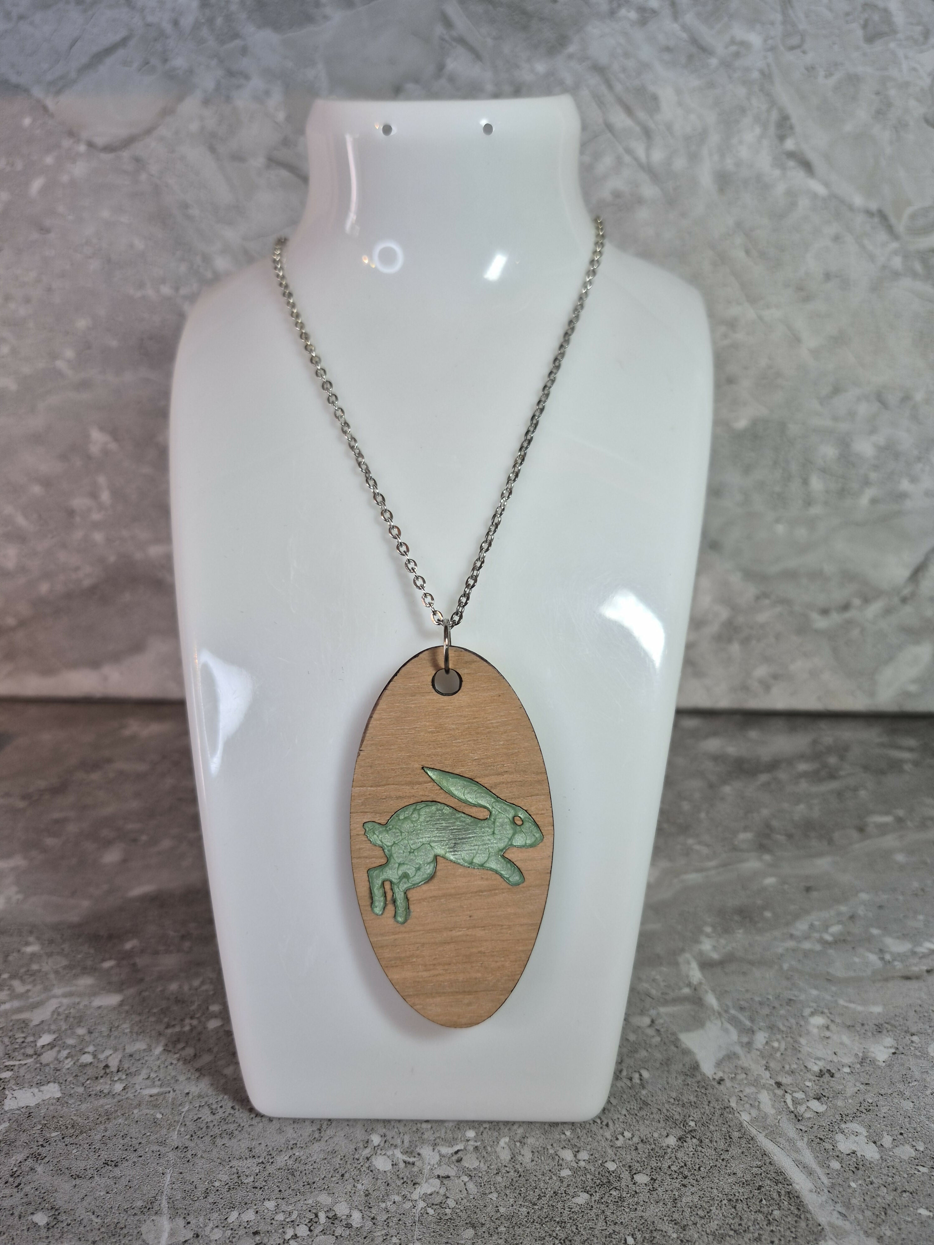 Unique Handcrafted Oval Cherry Wood Veneered Pendant With Engraved Leaping Hare