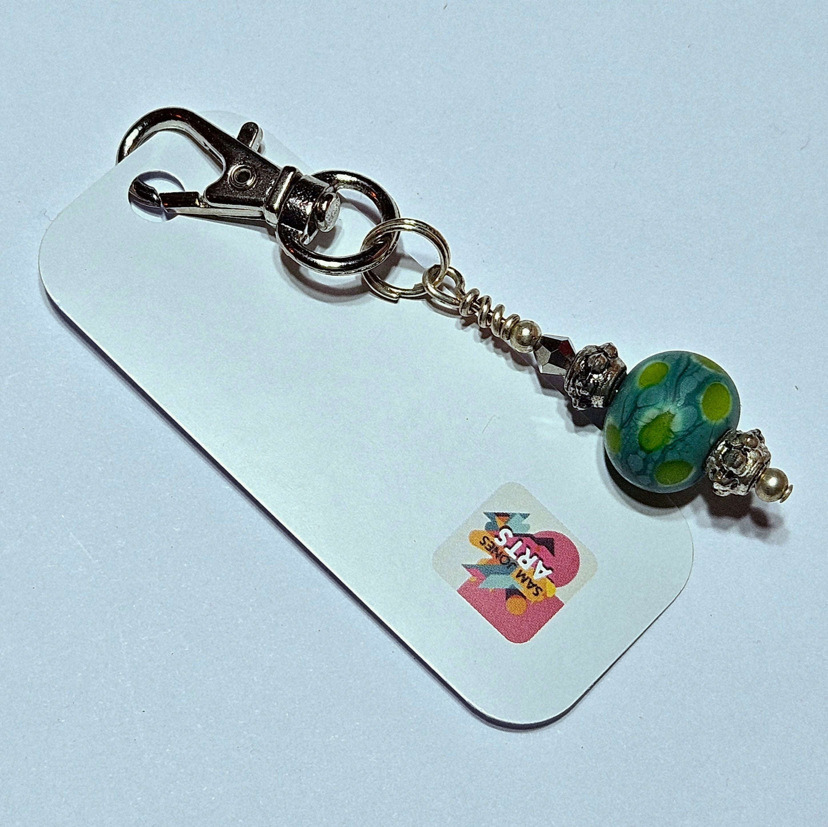 CHARMING GLASS BEADED BAG CHARM/KEYRING.