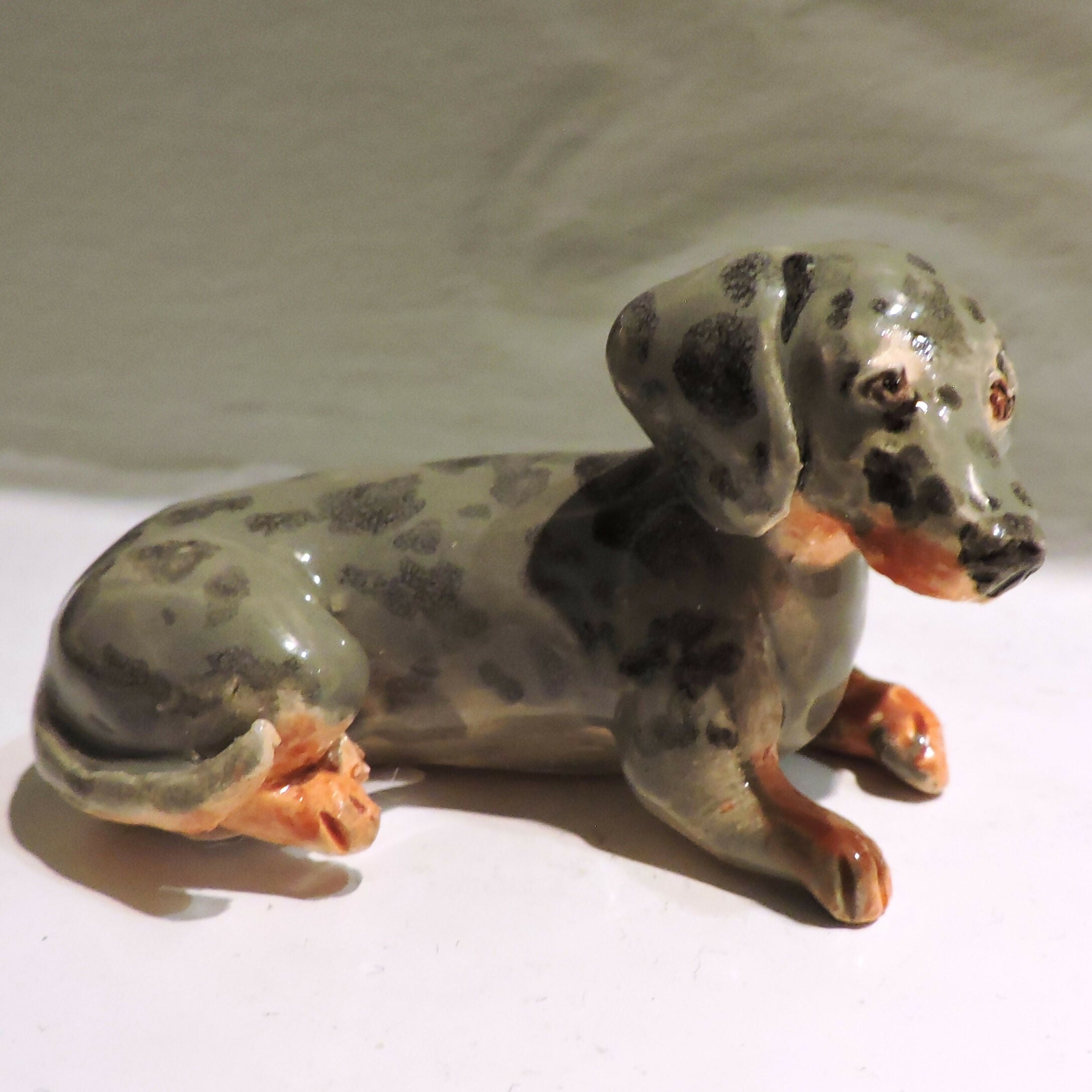 Ceramic silver dapple dachshund sculpture