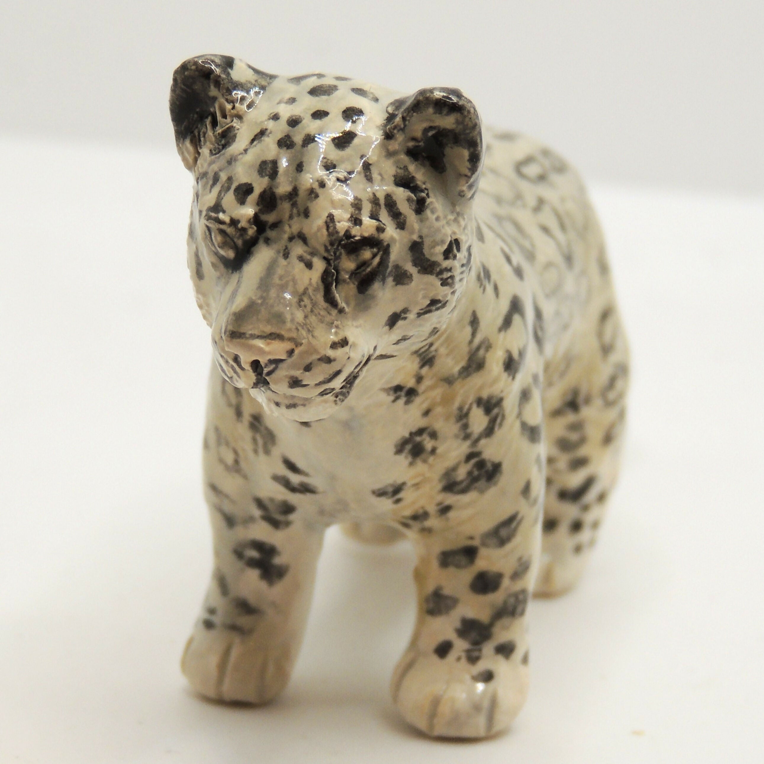 Ceramic Snow Leopard sculpture