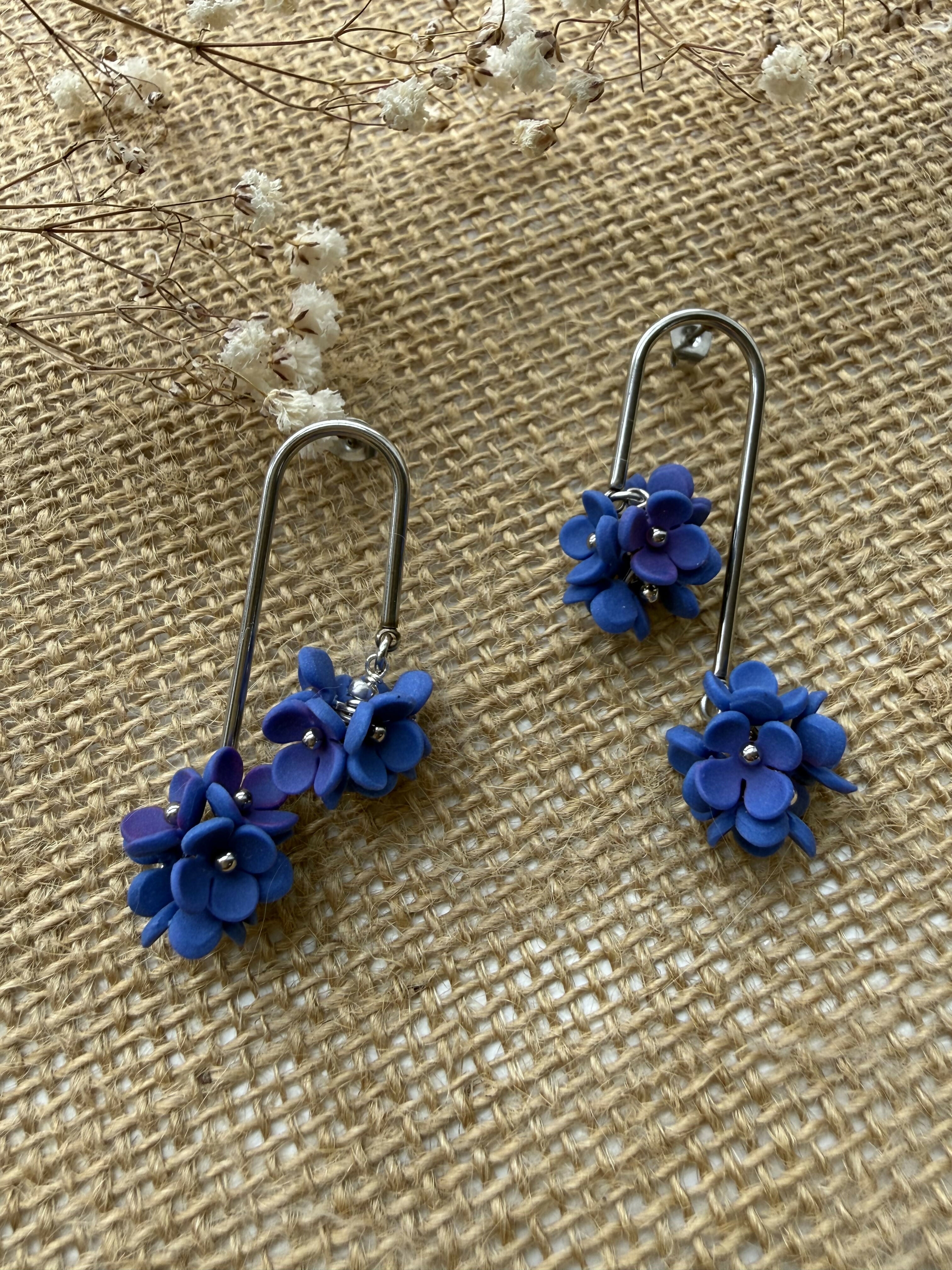Long Arc Drop Earrings with Blue Flower Cluster