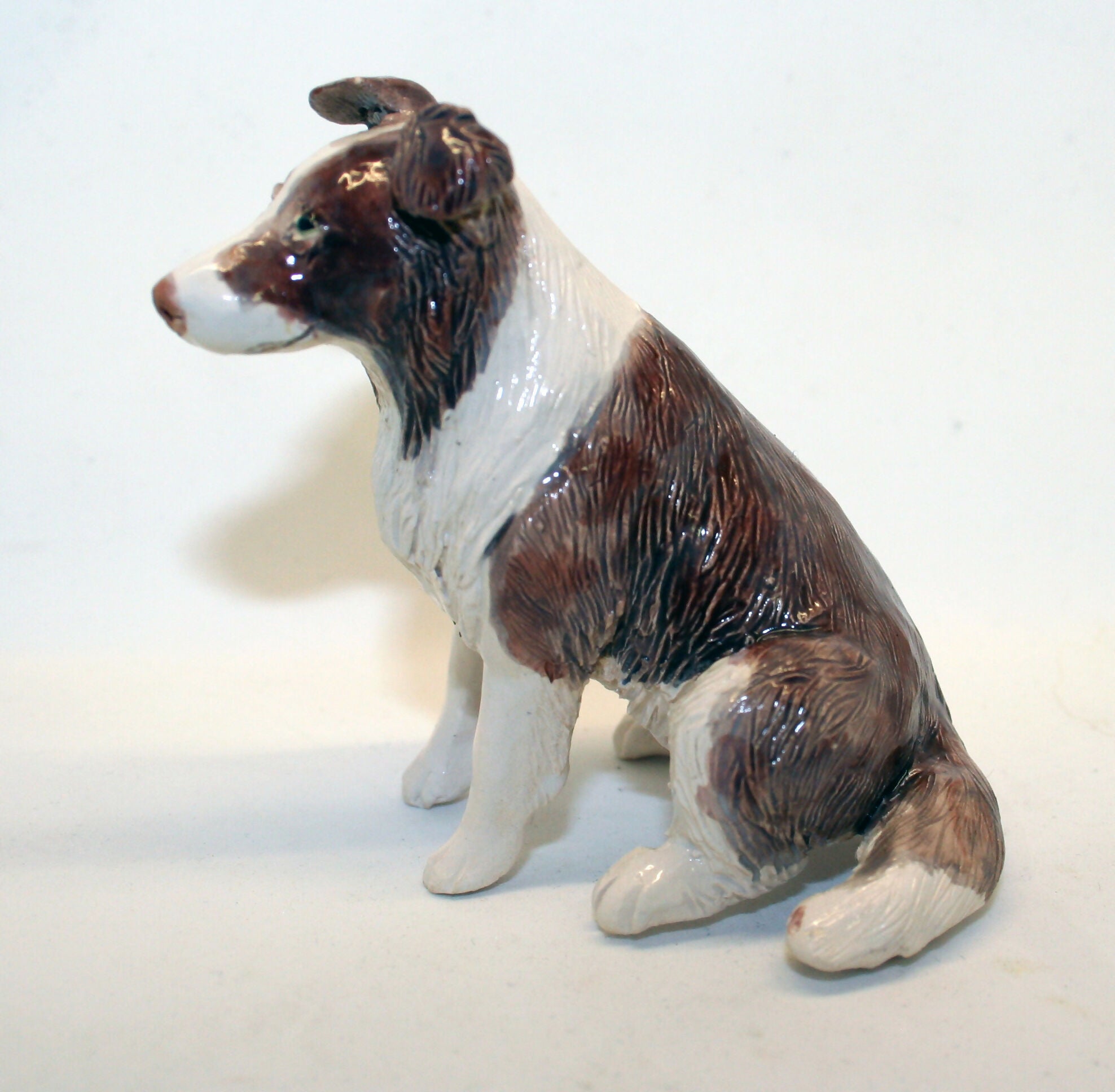 Ceramic red merle Border collie dog sculpture