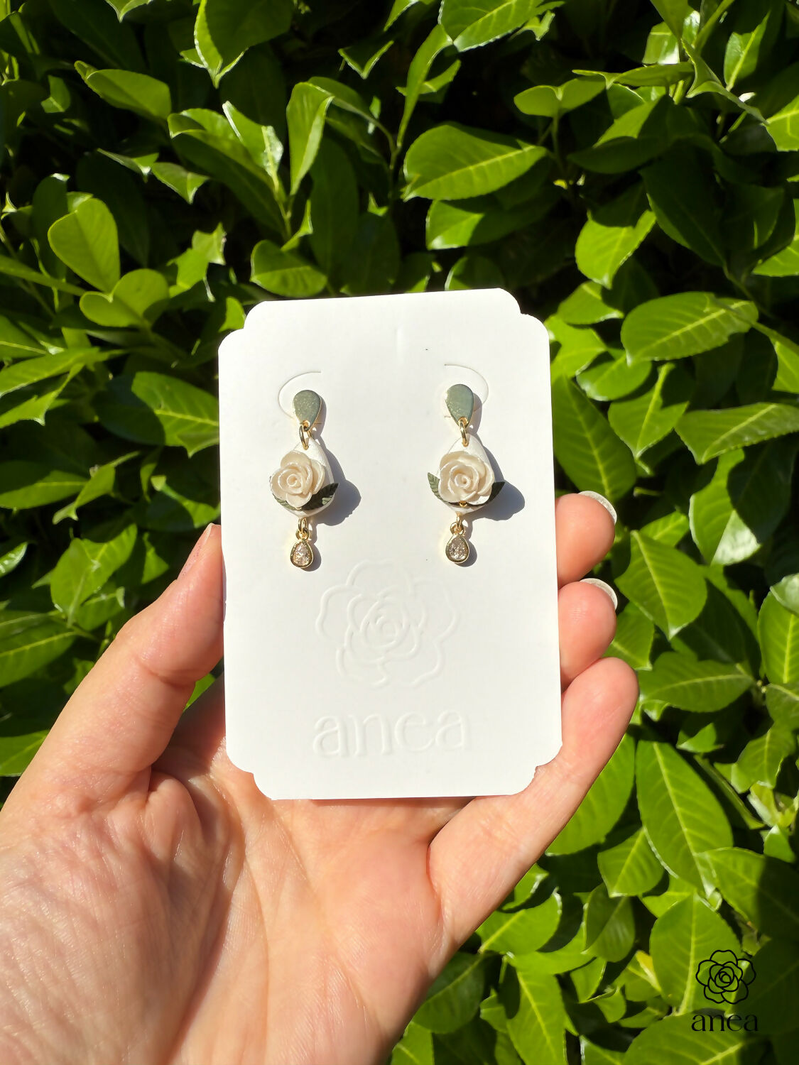 White Rose Drop Earrings with Green Leaf and Crystal Teardrop Detail