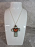 Handcrafted and engraved walnut veneered cross with a heart pendent.
