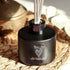 Reed Diffuser with black glass bottle and white reeds