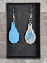 Handcrafted teardrop ivory and cyan colour earrings.