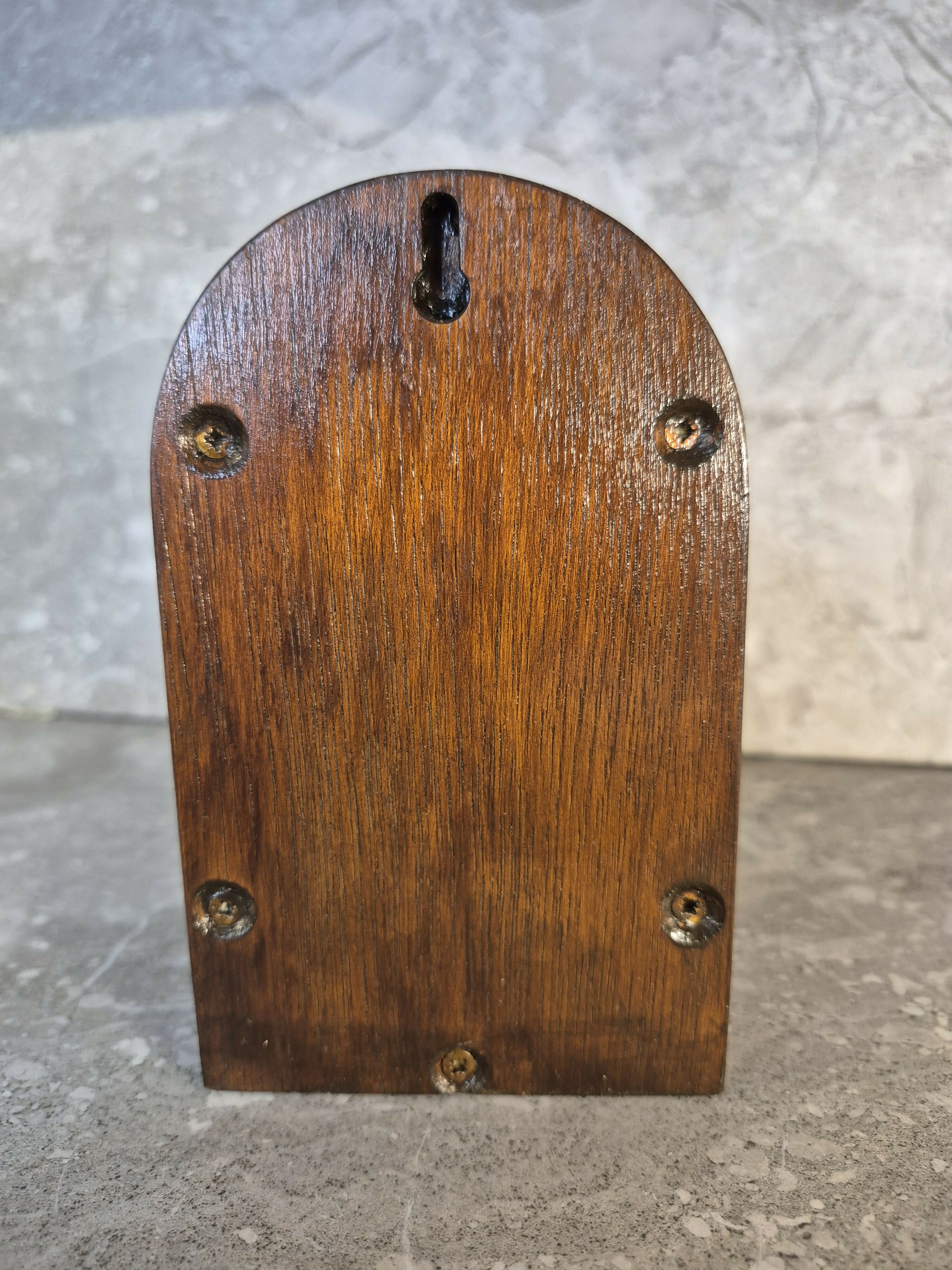 Handcrafted round arch opening wooden fairy door.