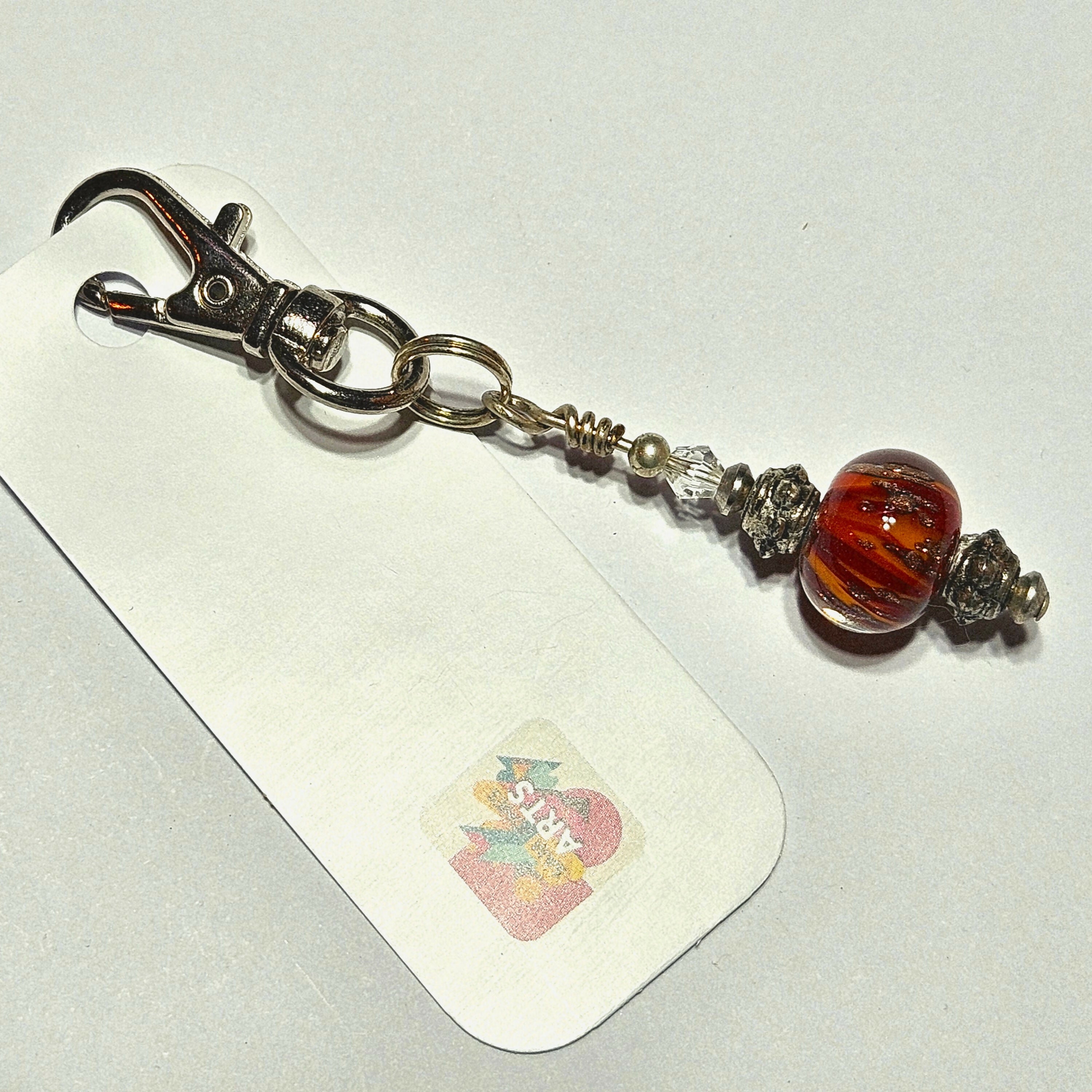 CHARMING GLASS BEADED BAG CHARM/KEYRING.