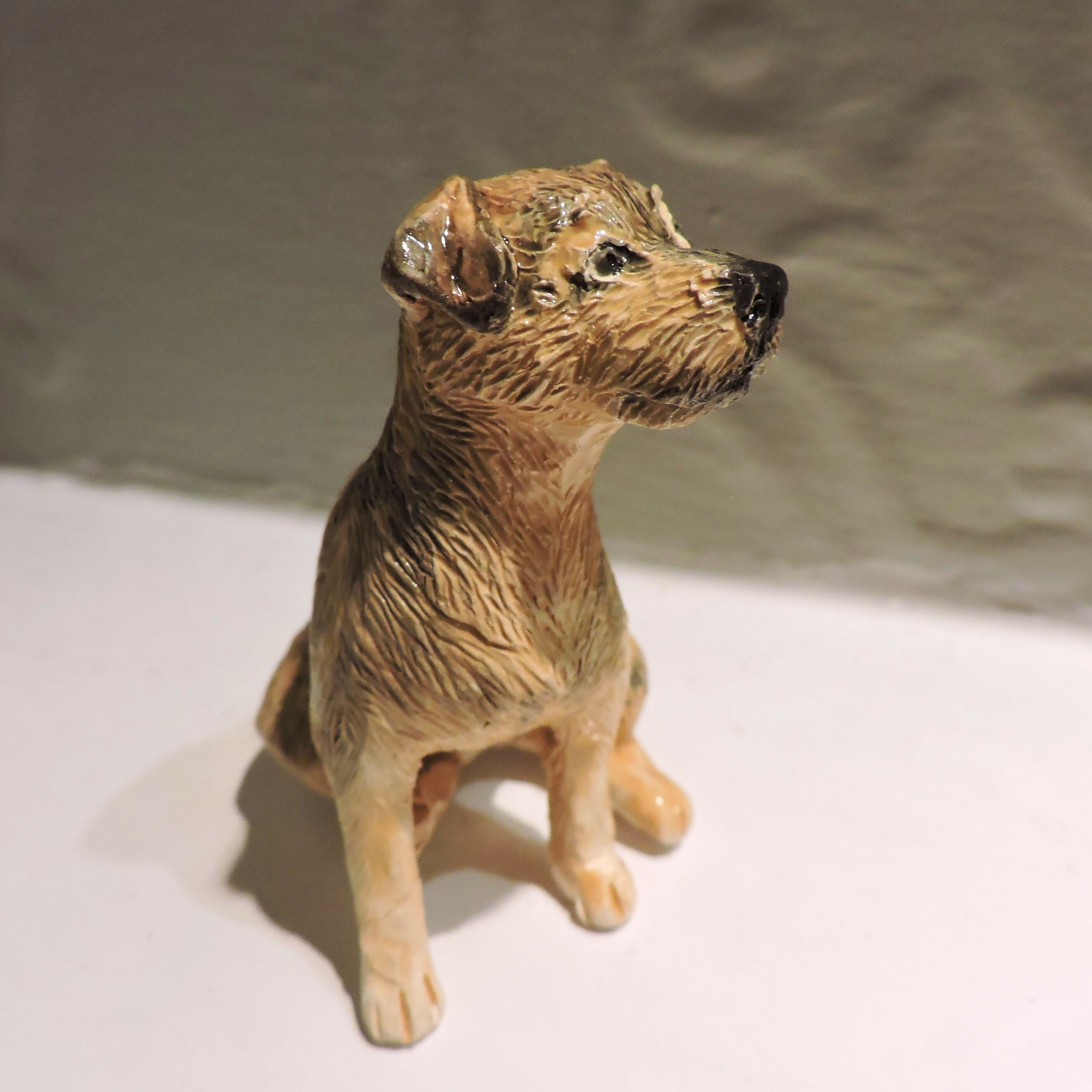 Ceramic border terrier dog sculpture