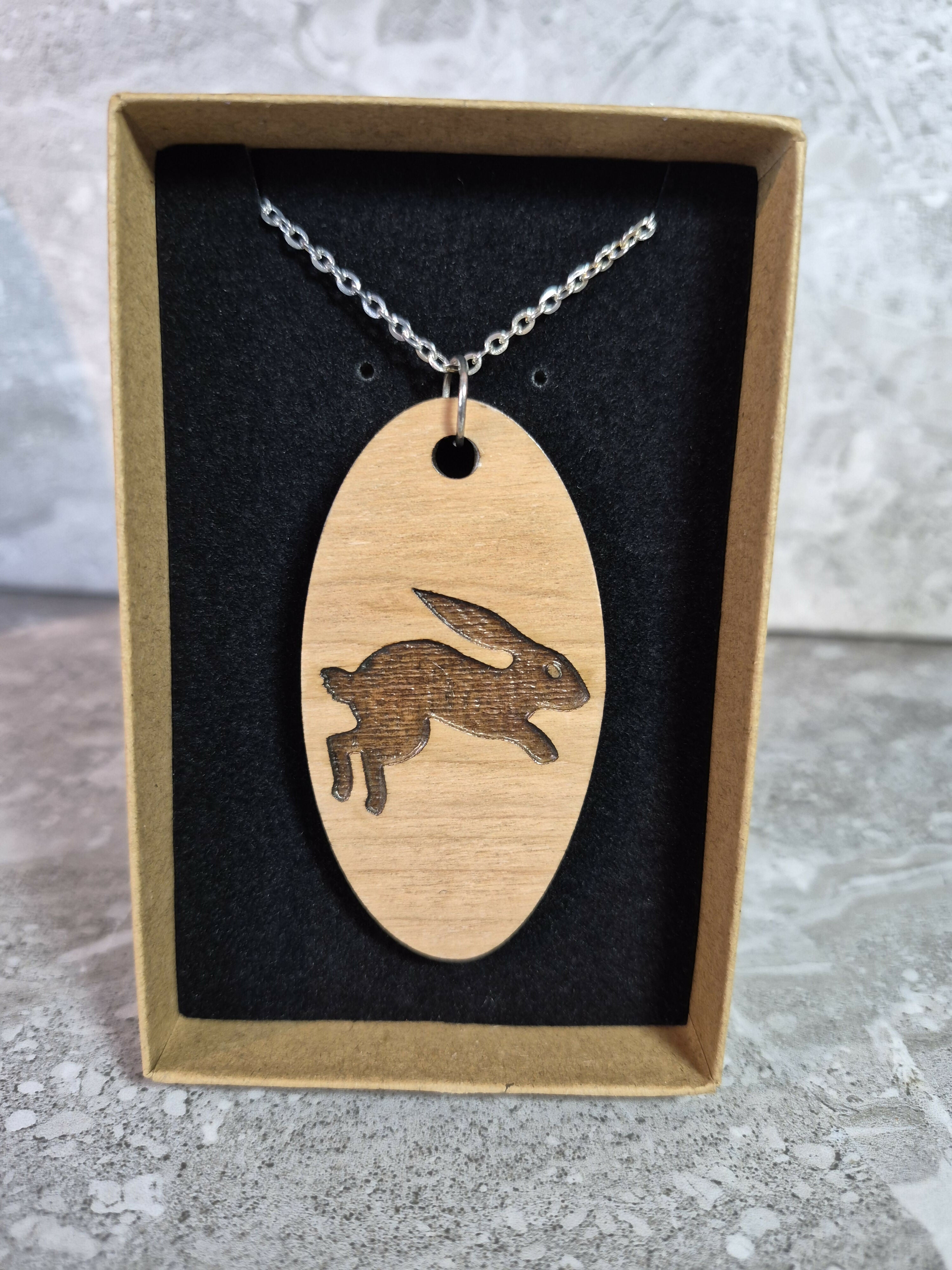 Unique Handcrafted, Oval, Cherry Veneered, Pendant With An Engraved Leaping Hare
