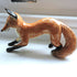 Ceramic pouncing fox sculpture