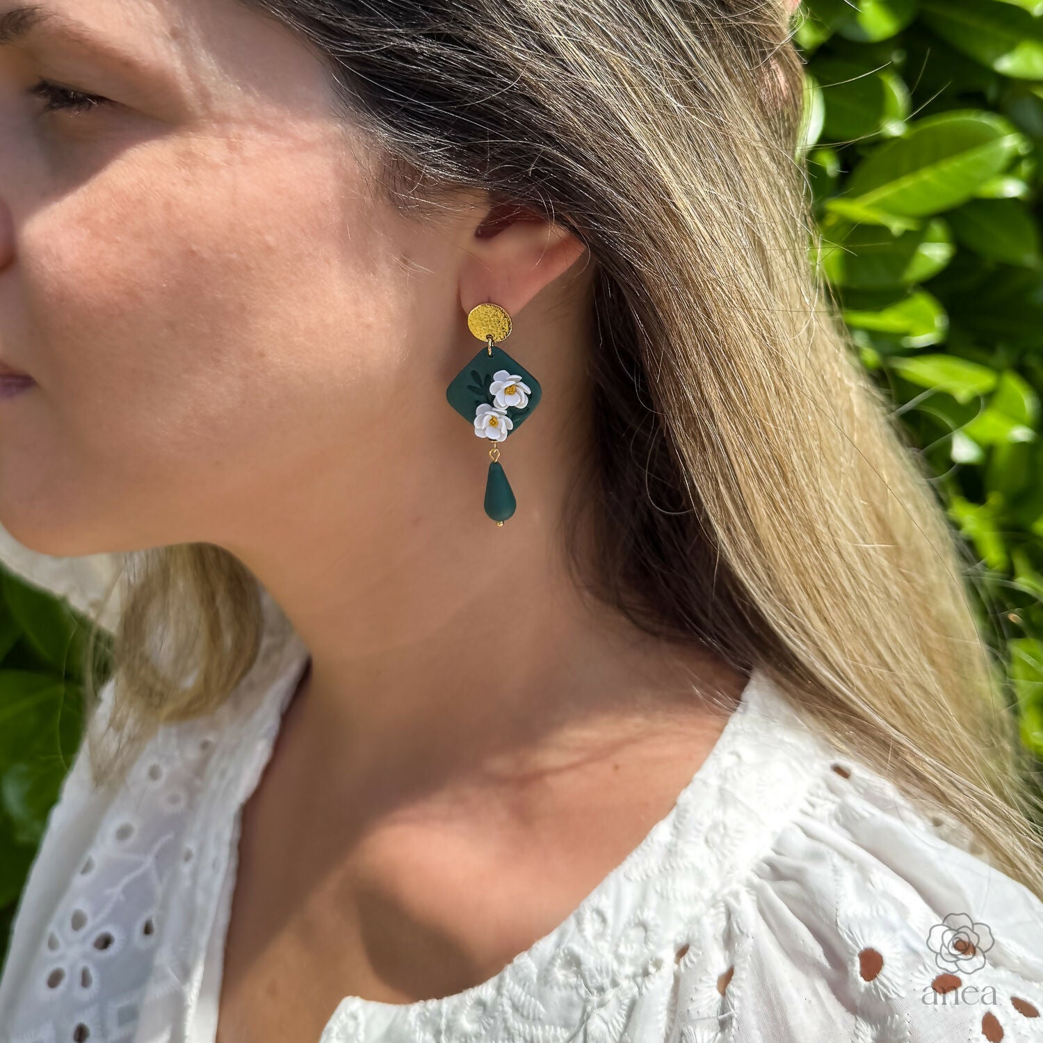 Green Floral Drop Earrings with White Blossoms and Gold Detail