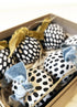 box of spotted baubles with velvet ribbon black and white