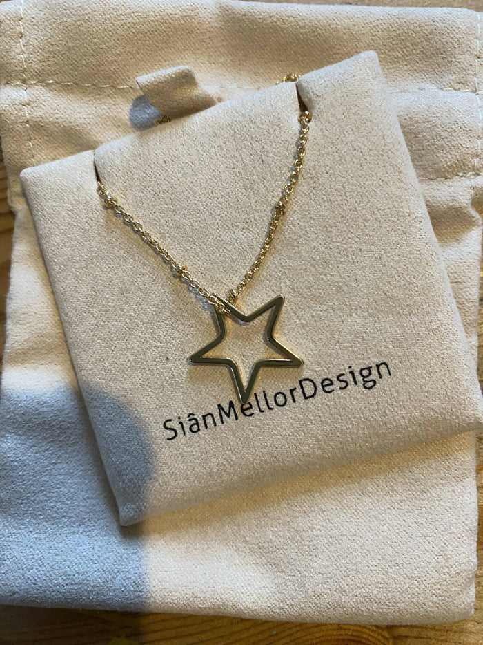 Gold plated hollow star necklace