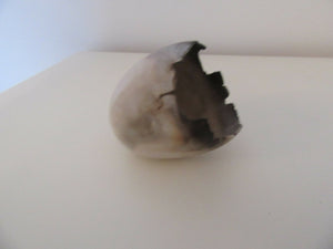 Smoke fired egg form vessel