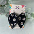 Daisy Print and Black Pinched Leaf Shaped Earrings in Faux Leather