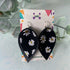 Daisy Print and Black Pinched Leaf Shaped Earrings in Faux Leather