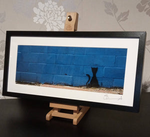 Graffiti cat on blue wall (wide pano frame)