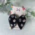 Daisy Print and Black Pinched Leaf Shaped Earrings in Faux Leather