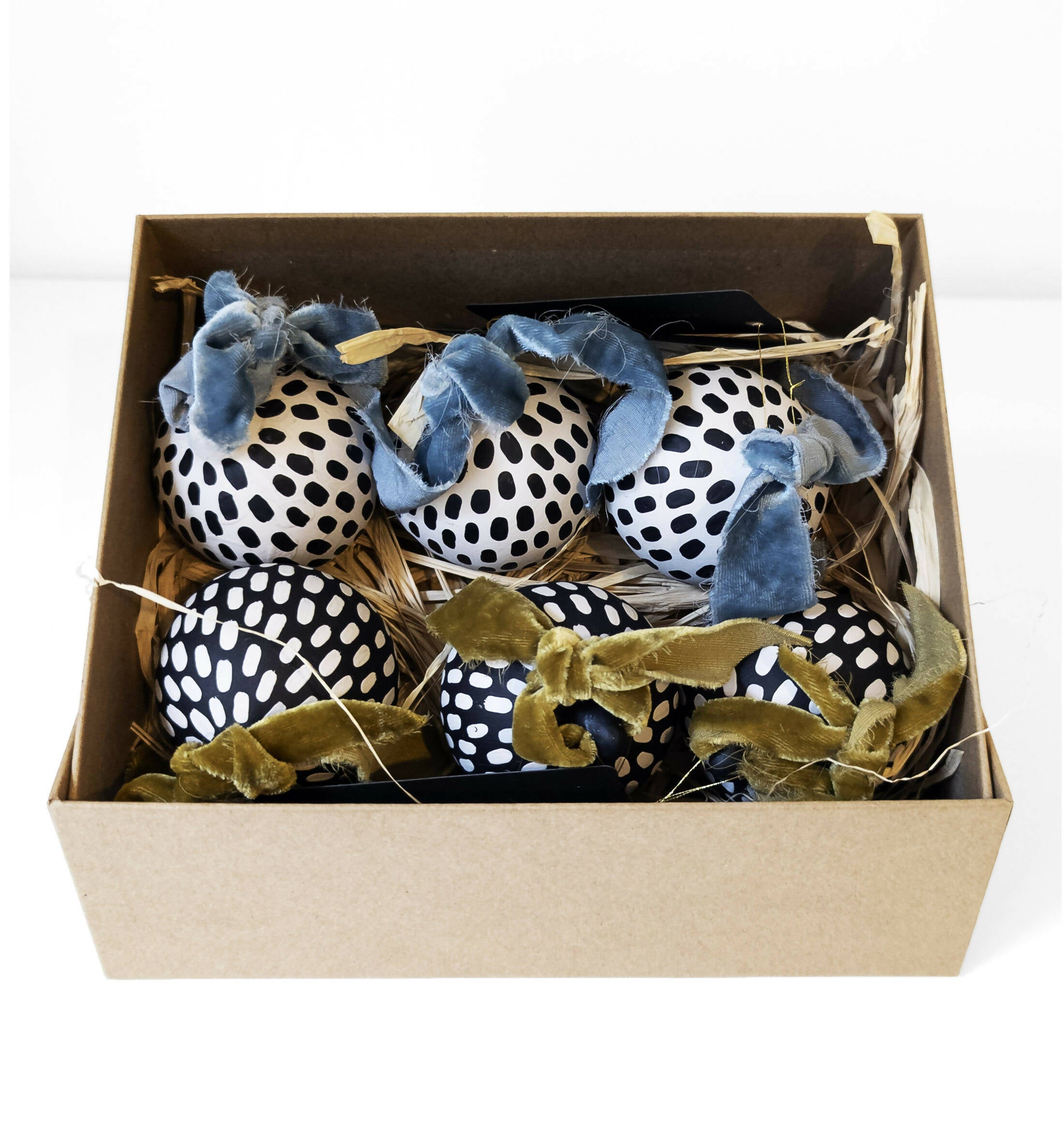 box of spotted baubles with velvet ribbon